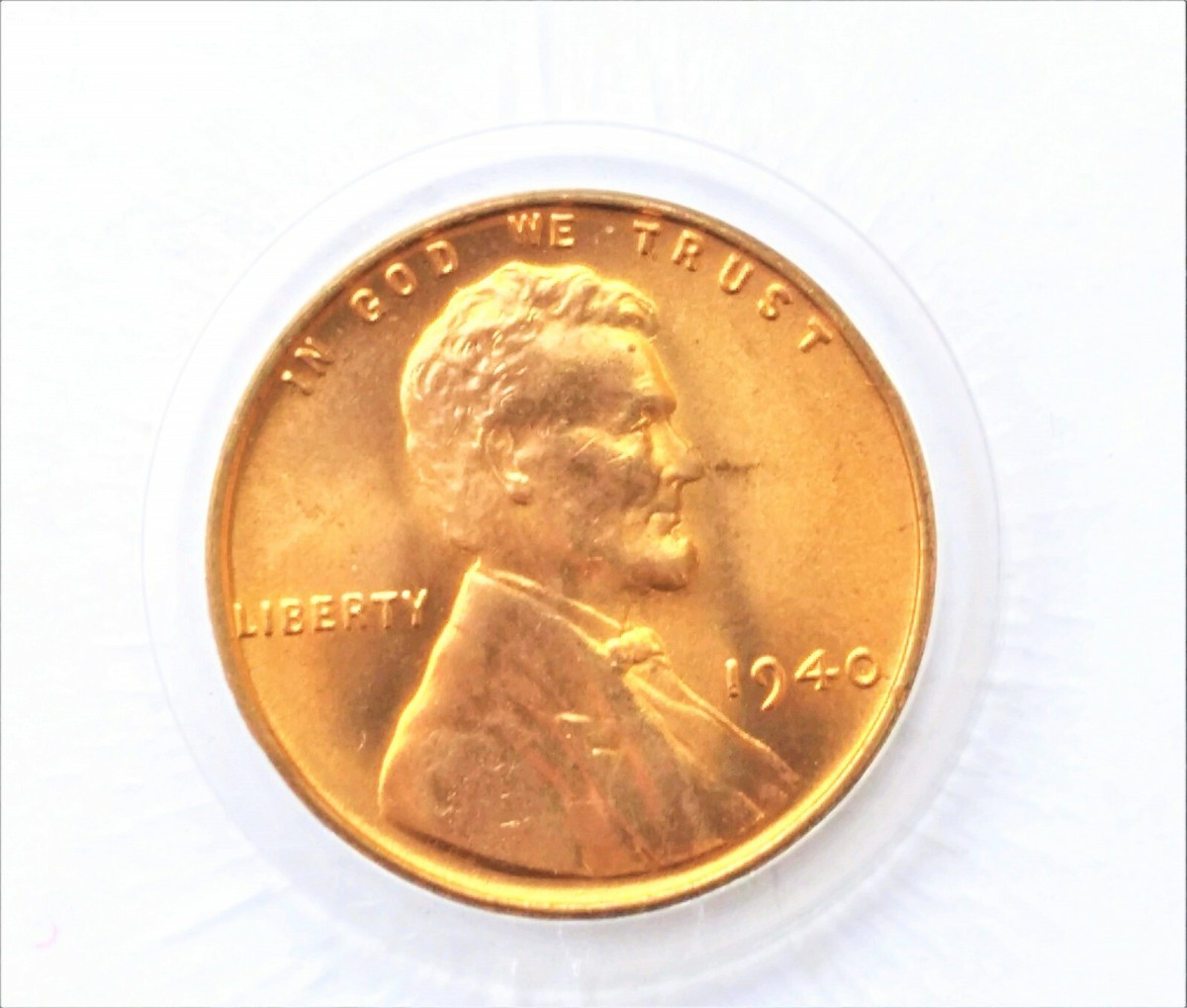 1940 wheat penny doubled die obverse (DDO) showing doubled lettering in IN GOD WE TRUST under magnification