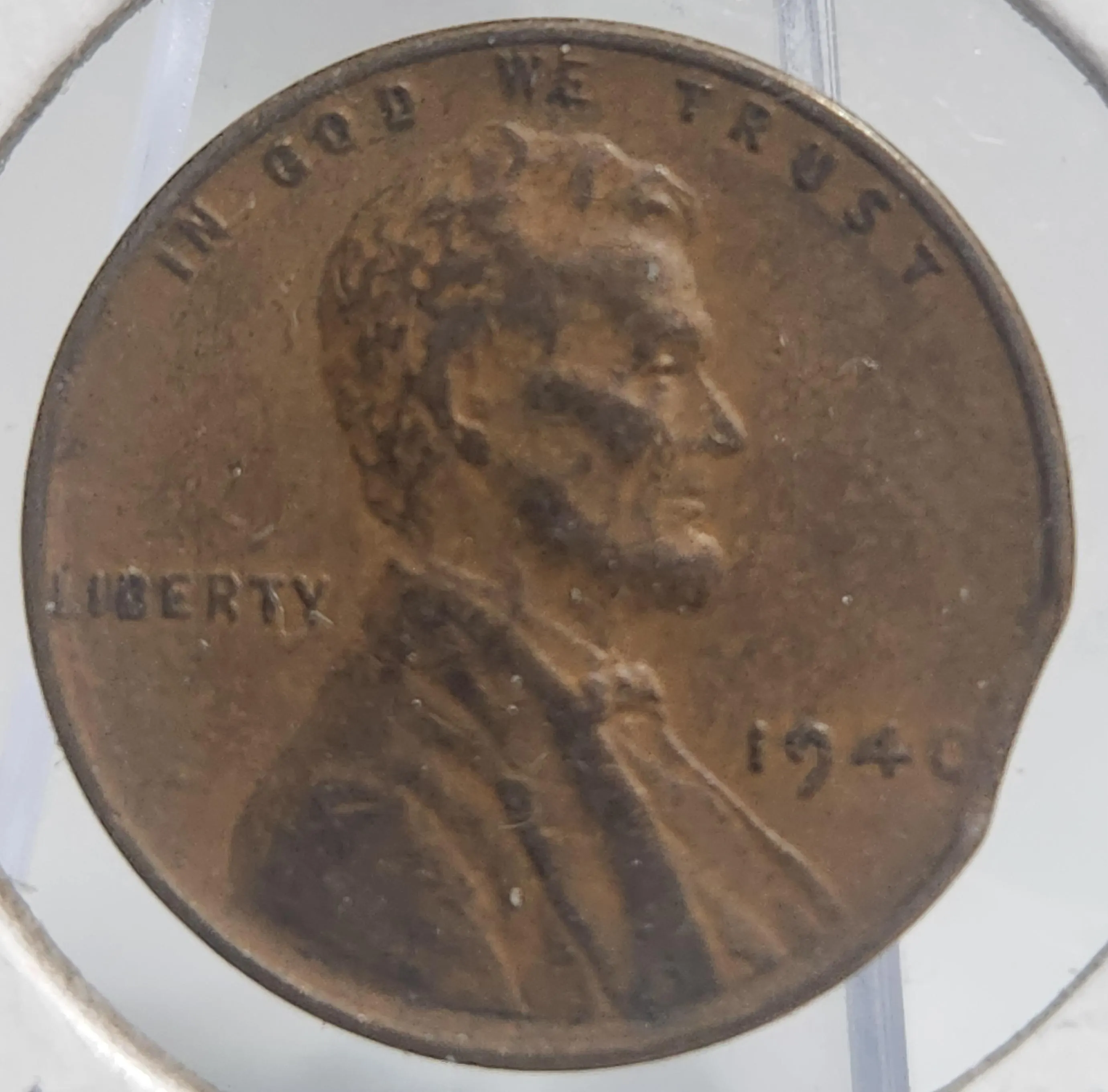 1940 wheat penny clipped planchet error showing missing curved metal section at coin edge and lamination surface defect